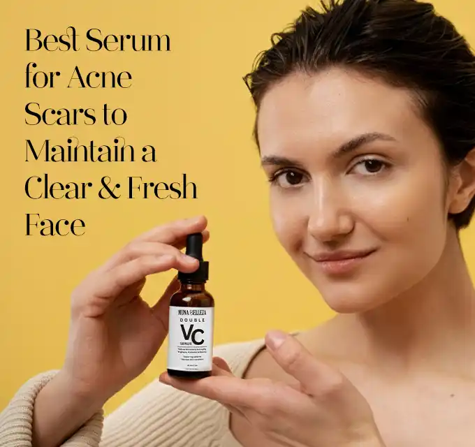 Woman smiling against a yellow background, holding an amber VC dropper bottle in her cupped hand, skin looks clear and dewy